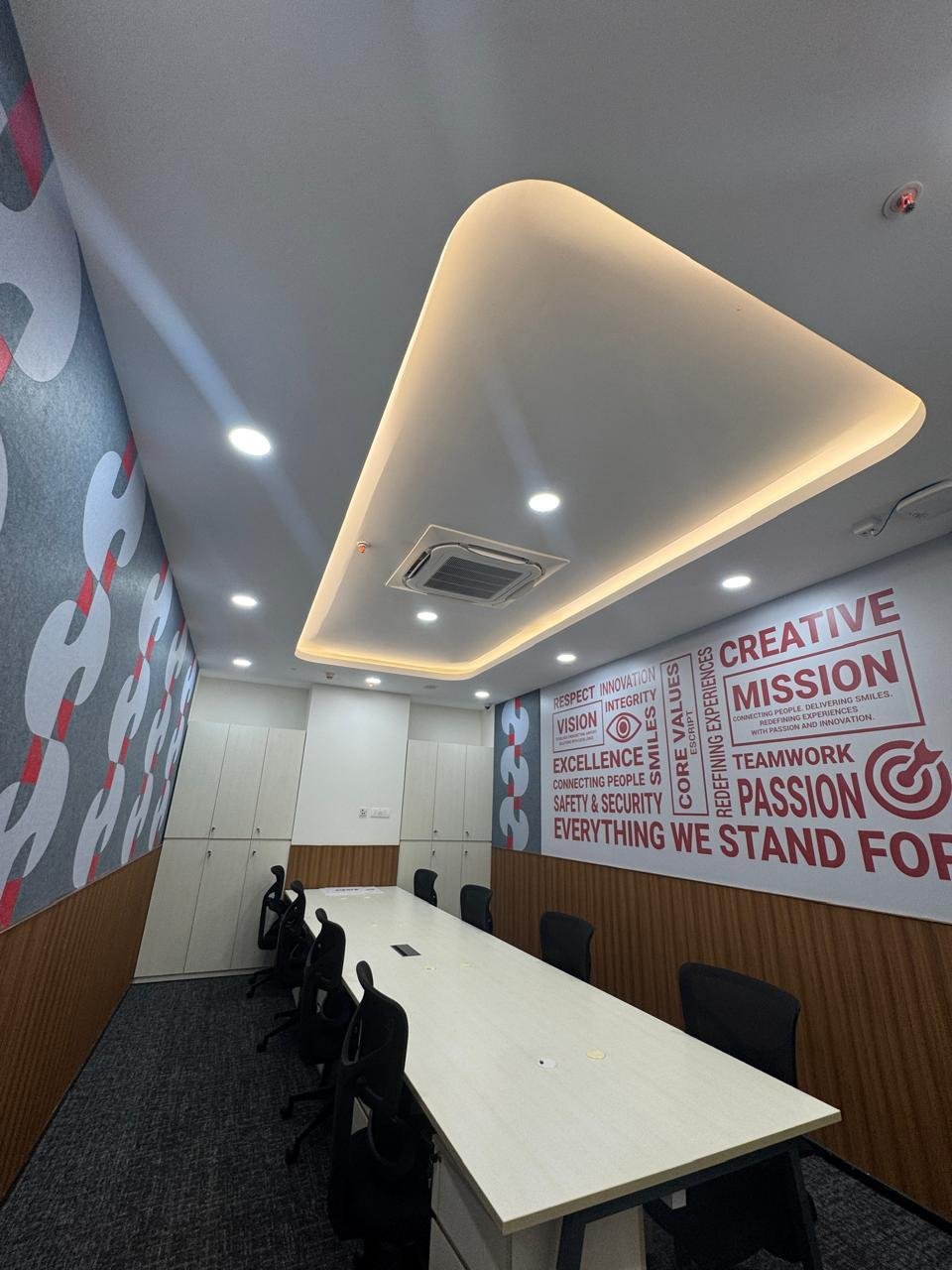 Branded team room with a sculpted ceiling cove at Air India, Kempegowda International Airport