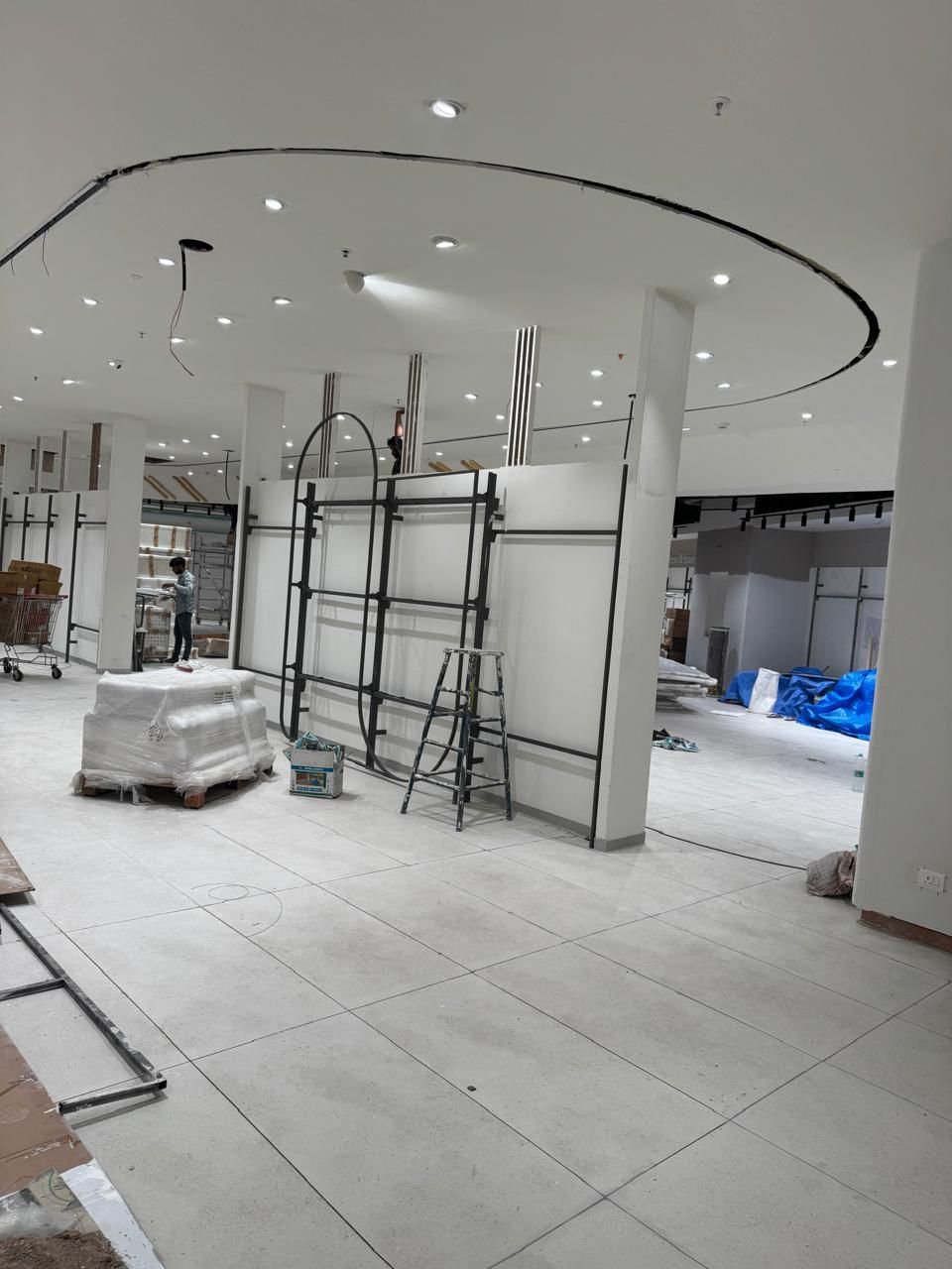 Curved ceiling and column detailing under construction