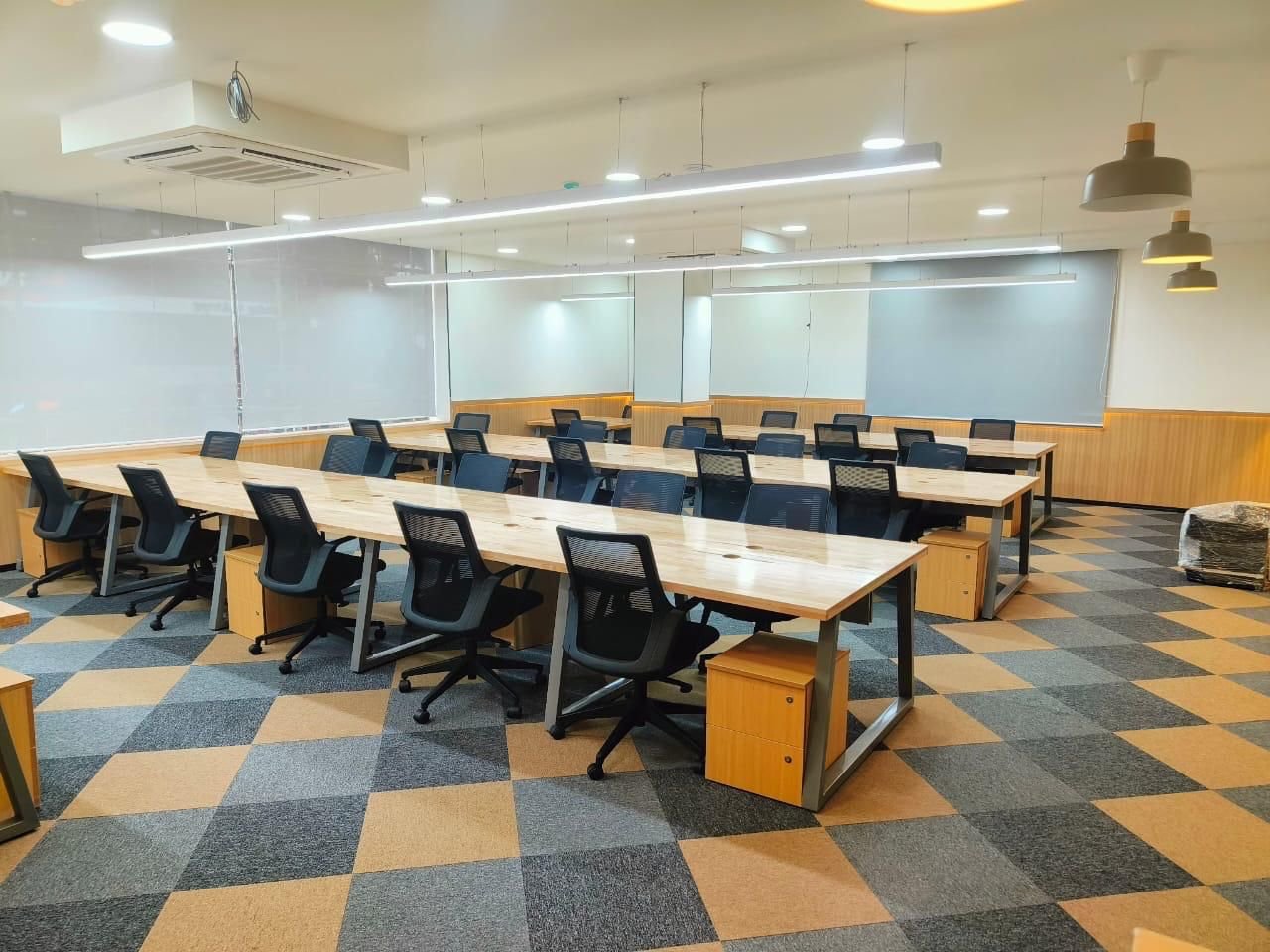 Open desk bay with checkerboard flooring