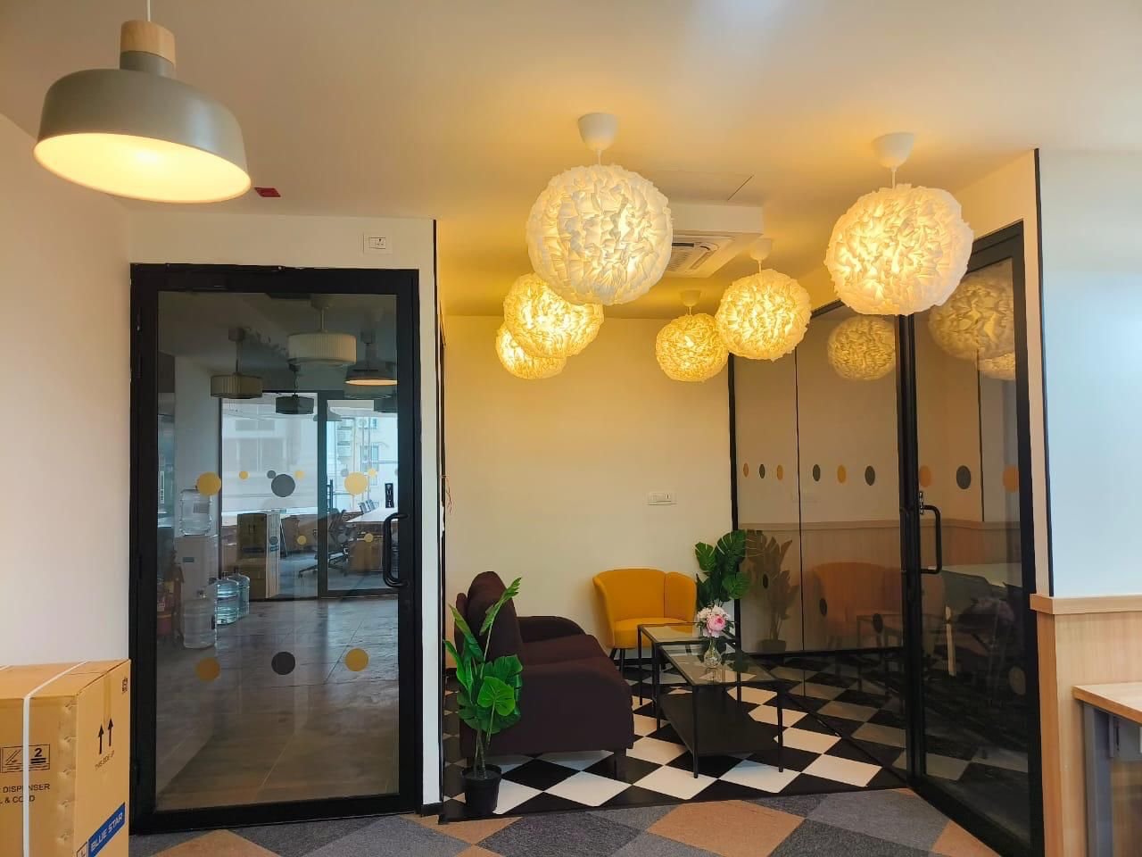 Glass-fronted meeting room with globe pendant lighting