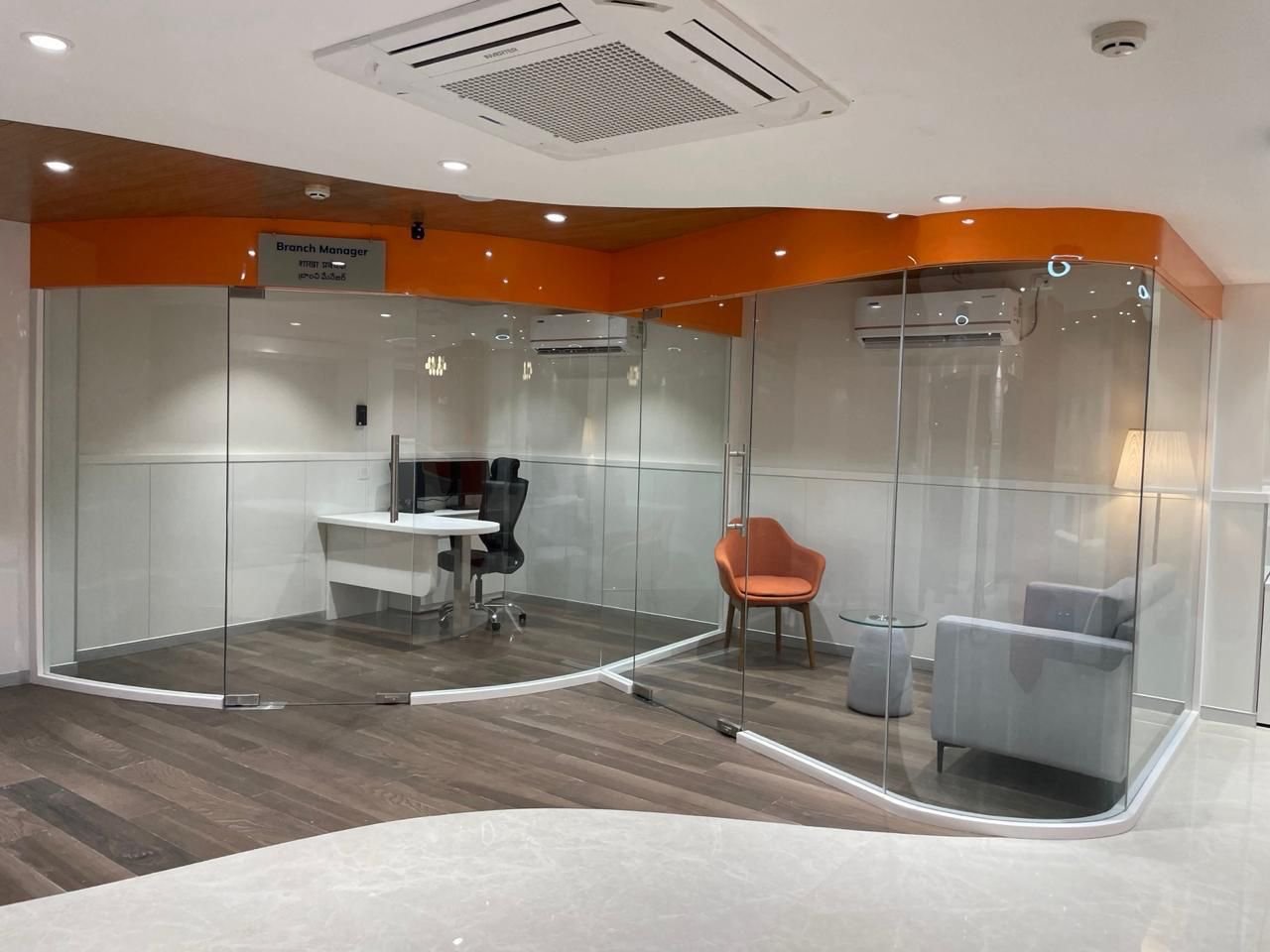 Glass-fronted branch manager cabin at ICICI Bank Bagmane Neon